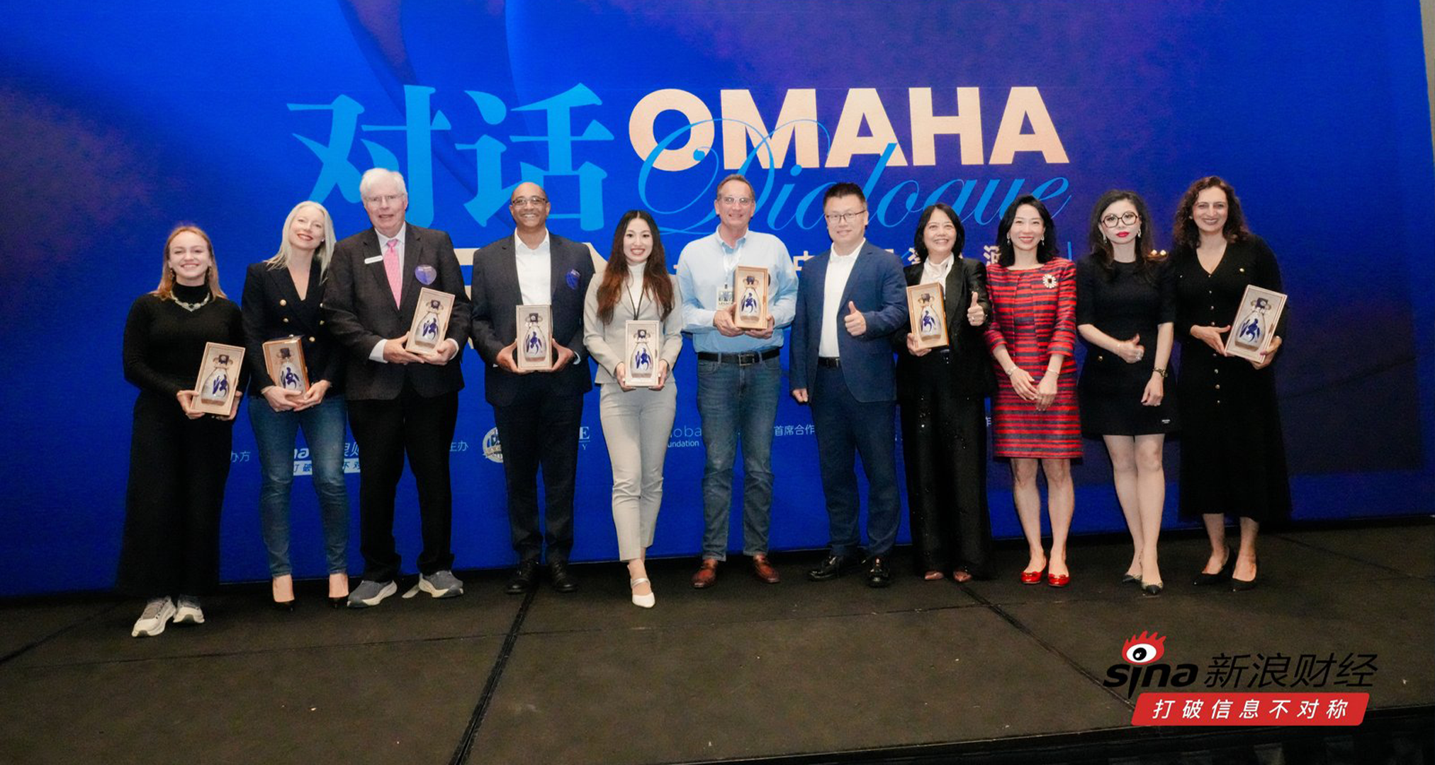 International award recipients gathered on stage at a global event